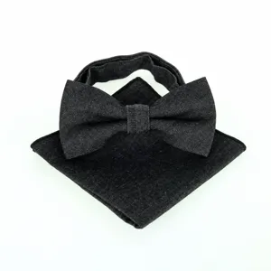 Denim bow tie and pocket square set detail showing the black textured fabric and design.
