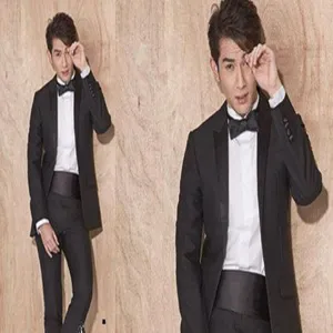 Detail view of stylish men's glossy tuxedo cummerbund and formal suit accessories for events.