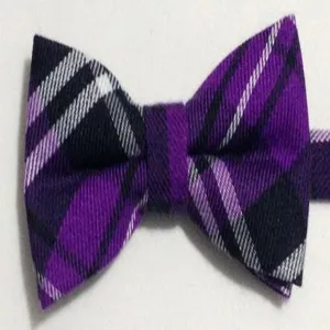 Purple and black plaid bow tie detail shot, classic British style men's fabric bow tie accessory.