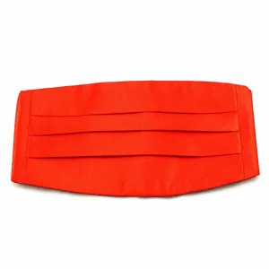 Red satin tuxedo cummerbund detail showing pleat texture and bright finish for formal wear.
