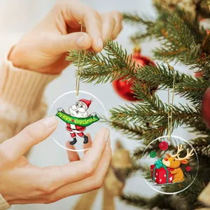 Clear acrylic Christmas tree ornaments with golden strings, featuring festive Santa reindeer.