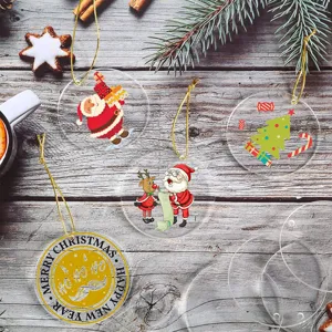 Round clear acrylic Christmas ornaments with gold strings for DIY holiday tree hanging decor.