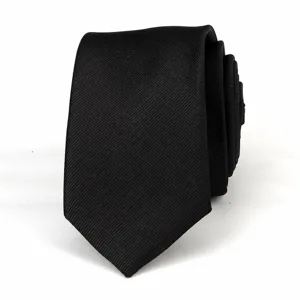 Detailed view of classic black twill necktie, fine texture, elegant professional accessory