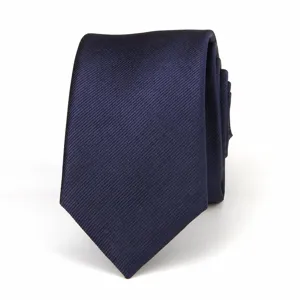 Detailed view of the classic navy blue twill necktie, exquisite texture and neat fold.