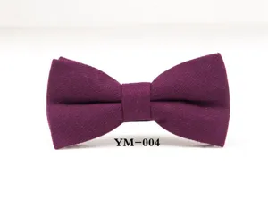 Close-up of wine red wool bow tie featuring fine twill texture and classic structured bow shape.