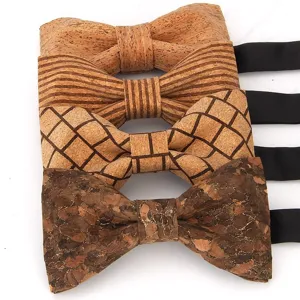Close-up view of four unique cork bowties featuring various textures like stripes and grid patterns.
