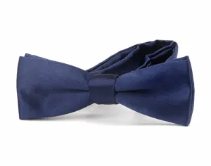 Close-up detail of the navy blue satin bow tie fabric texture and neat knot craftsmanship.