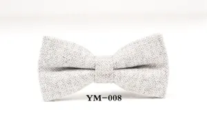 Detailed shot of the grey herringbone wool bow tie showing texture and fabric craftsmanship.