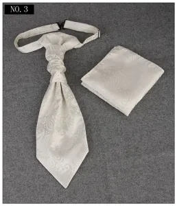 Detail shot of men wedding ascot tie and pocket square set with elegant paisley jacquard pattern.