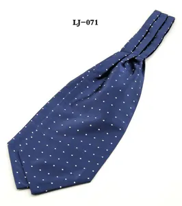Close-up detail of the elegant blue polka dot men's ascot tie showing fine fabric texture.