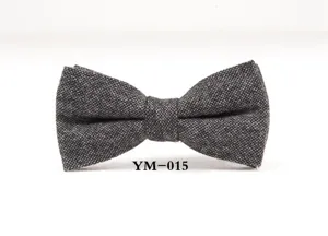 Detail view of dark grey wool bow tie, showing fine textured fabric and classic shape.