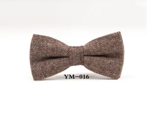 Brown textured wool bow tie detail view, classic mens formal wedding tuxedo neckwear accessory