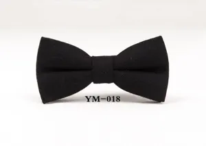 Close up detail of classic black wool bow tie, perfect for wedding and business suit.