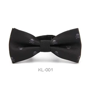 Detail view of the black men bow tie featuring a subtle skull and crossbones woven pattern.