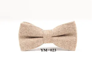 Detail shot of a brown wool tweed bow tie, featuring classic texture for formal events.