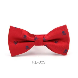 Men's red bow tie with blue skull pattern, stylish formal wear accessory for parties.