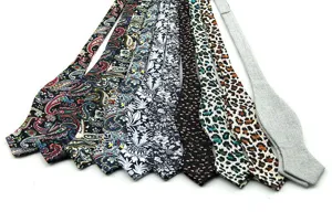 Men's fashion printed bow ties collection featuring paisley floral and leopard patterns.
