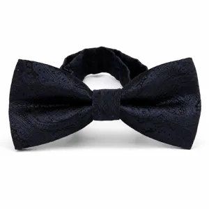 Classic navy blue paisley bow tie detail, elegant men's formal wear accessory for wedding.