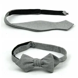 Close-up detail of grey textured diamond point self-tie men bowtie, fabric closeup view.