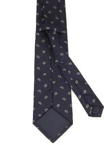 Primer plano de una corbata de hombre azul oscuro con delicado patrón de cachemira y etiqueta.