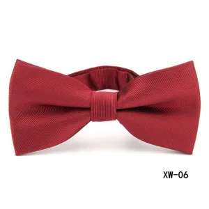 Red striped bow tie detail closeup, classic men's formal suit accessory for business.