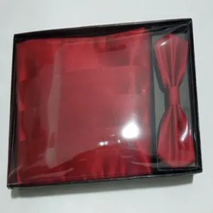 Red silk-like cummerbund and bow tie set in gift box, exquisite wedding party formalwear detail.