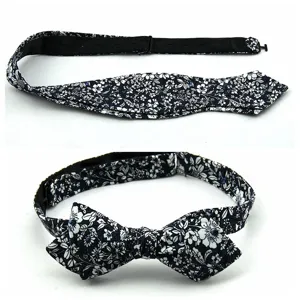 Close-up details of the men's floral sharp-corner self-tie bow tie showcasing fine fabric.