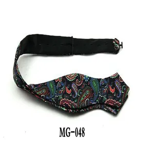 Detailed view of the men's paisley bow tie showing fine fabric texture and adjustable strap.