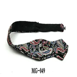 Detailed view of men's fashion paisley bow tie with adjustable strap, classic pattern design.