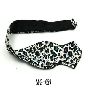 Close up detail of mens abstract printed pointed bow tie with adjustable black strap.