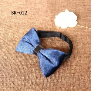 Men's blue velvet bow tie with leather center strap, elegant wedding and evening suit accessory.