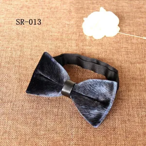 Details of velvet bow tie with black strap, ideal accessory for men's formal suit and wedding.