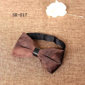 Brown velvet bow tie for men, detailed view of textured printed bowknot with black neck strap.
