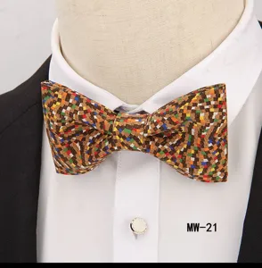 Close-up detail of the stylish cork bow tie featuring colorful geometric mosaic pattern.