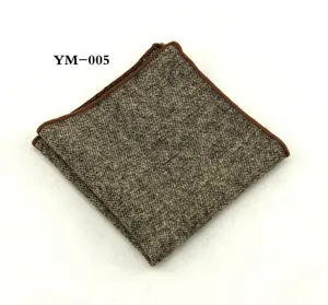 Detailopname van een wollen tweed heren pochet met een bruine rand voor nette pakken.