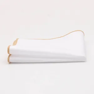 White cotton pocket square detail, rolled beige edge, elegant men suit accessory.