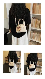 Detailed view of the stylish women's bowling handbag in beige, featuring a cute plush bear keychain.