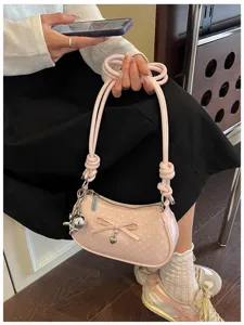 Chic pink polka dot shoulder bag with bow detail, stylish trendy casual daily axillary bag.