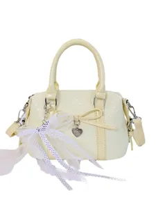 Women's cute yellow handbag shoulder crossbody bag with bow and lace decoration for daily commute.