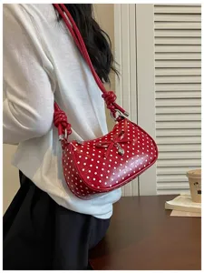 Red white polka dot shoulder bag with bow detail, stylish underarm purse for daily wear.