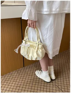 Stylish ruched polka dot handbag for women, soft leather cloud bag with bow and pearl pendant.