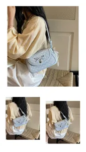 Chic polka dot shoulder bag for women, trendy crossbody underarm handbag with bow detail.