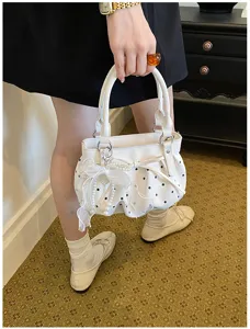 White ruched polka dot handbag for women with bow and pearl pendant charm stylish daily use.