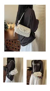 Detailed view of women white polka dot shoulder underarm bag with cute bow and lace trim design.