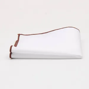 Detail shot of white men pocket square with brown contrast edge, premium cotton pocket handkerchief.