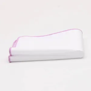 Detailed close-up of the white pocket square with pink stitched edge, premium suit accessory.