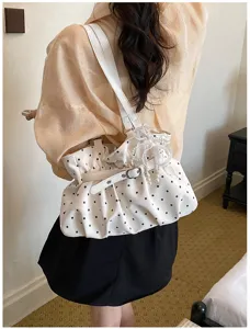 Stylish white polka dot gathered shoulder bag with pearl decor for women daily commute.