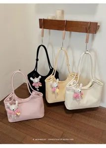 Minimalist PU leather tote bag for women, large capacity shoulder bag with cute knit pendant.