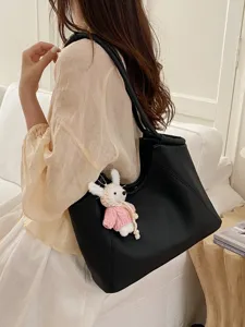 Black leather tote shoulder bag for women, large capacity handbag with cute knit rabbit charm.