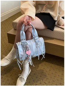 Light blue fashion Boston handbag for women, chic commuting crossbody bag with cute heart charm.